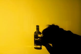 
		An employee with a bottle of alcohol in his hand
	